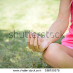stock-photo-yoga-in-the-park-summer-day-298799978