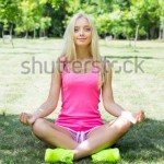 stock-photo-beautiful-blonde-is-engaged-in-yoga-in-the-park-308411246